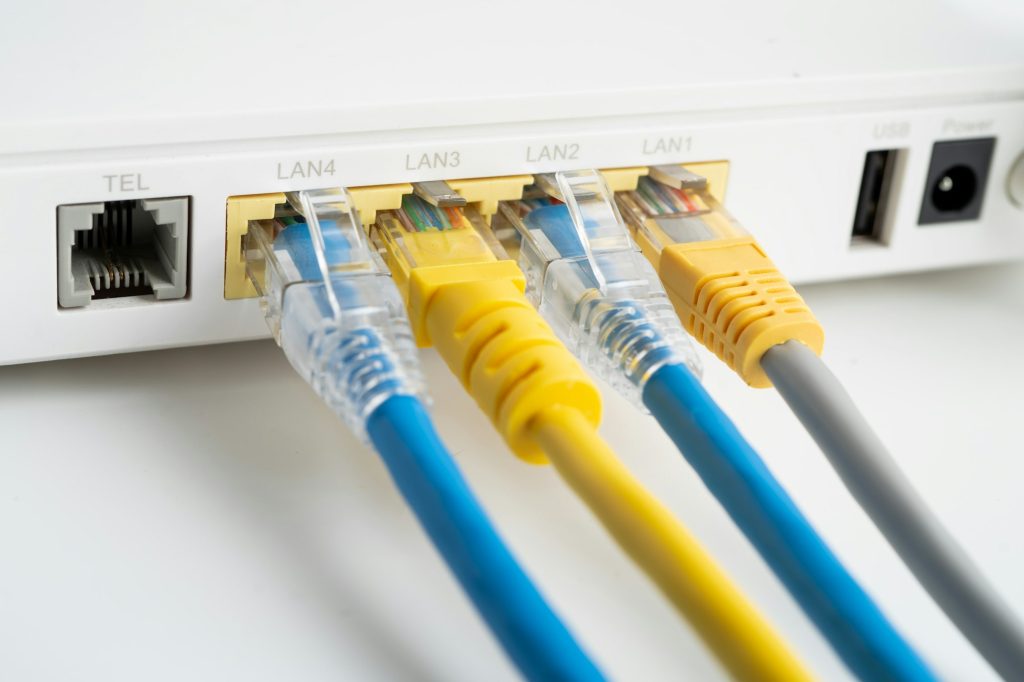 Ethernet cable with wireless router connect to internet service provider internet network.