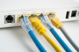 Ethernet cable with wireless router connect to internet service provider internet network.