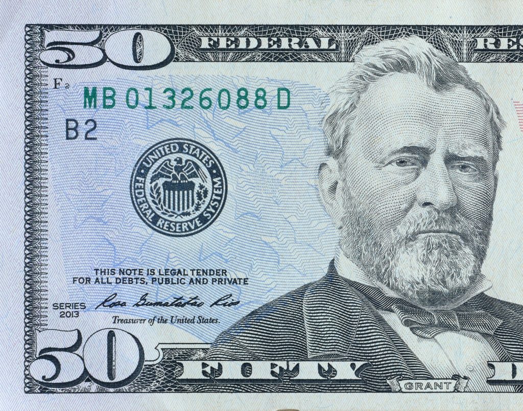 Portrait of US president Ulysses Simpson Grant on 50 dollars banknote closeup macro fragment