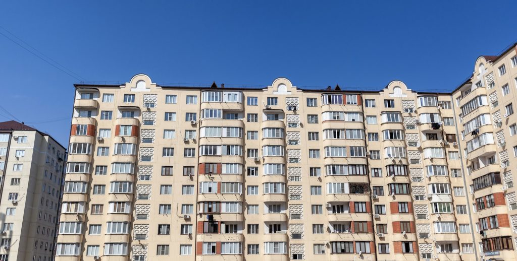 Old residential apartment building with windows, balconies