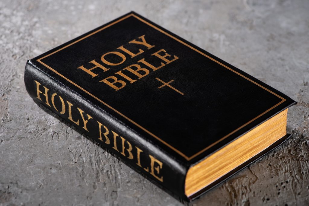 holy bible on grey textured surface