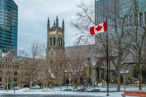 St. George's Anglican Church at Canada Square with flag - Montreal, Quebec, Canada