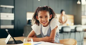 Education, child and portrait in home with tablet, notebook or happy with connectivity for learning